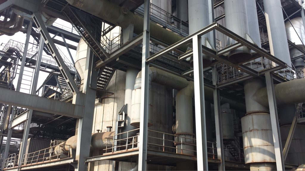 Steel structure and insulated piping at an industrial plant